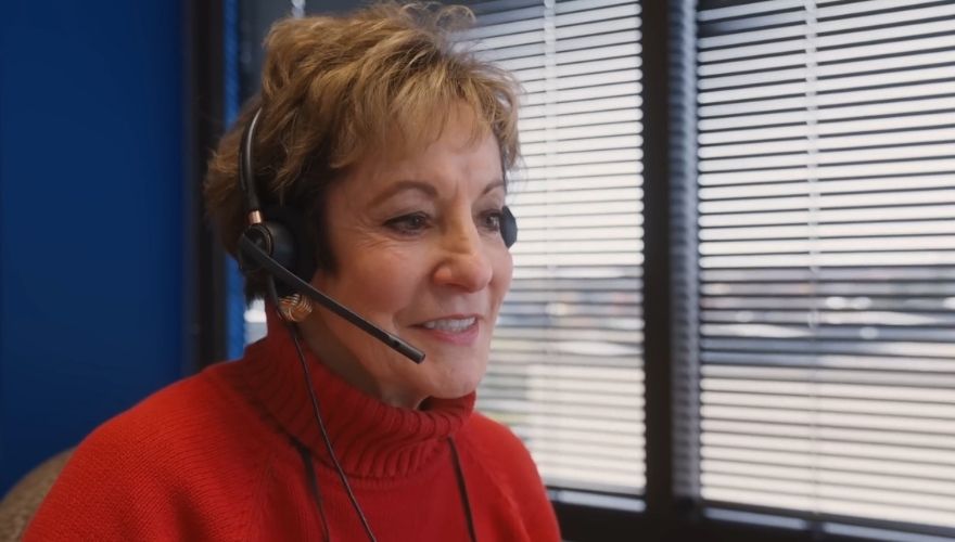 Phyllis Kramer wearing a headset while answering calls for the Butterball Turkey Talk-Line.